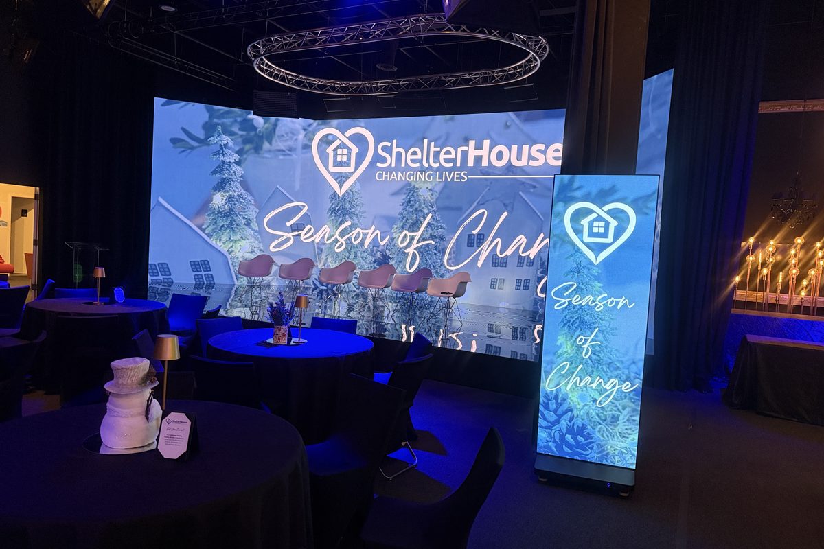 a professional event venue setup for ShelterHouse's 