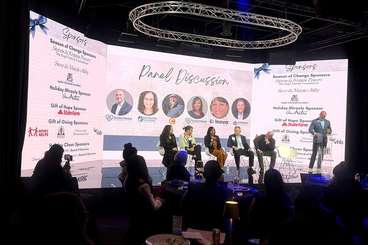 # Panel Discussion at Charity Event

This image captures a 