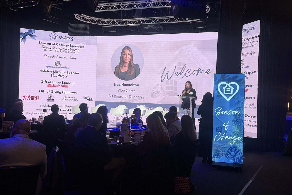 This image captures a professional gala or charity event where Naz Hesselton, Vice Chair of the SH Board of Directors, is…