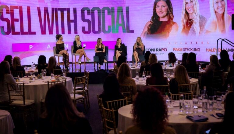 # Image Description This image captures a professional panel discussion event titled "Sell with Social" featuring five…