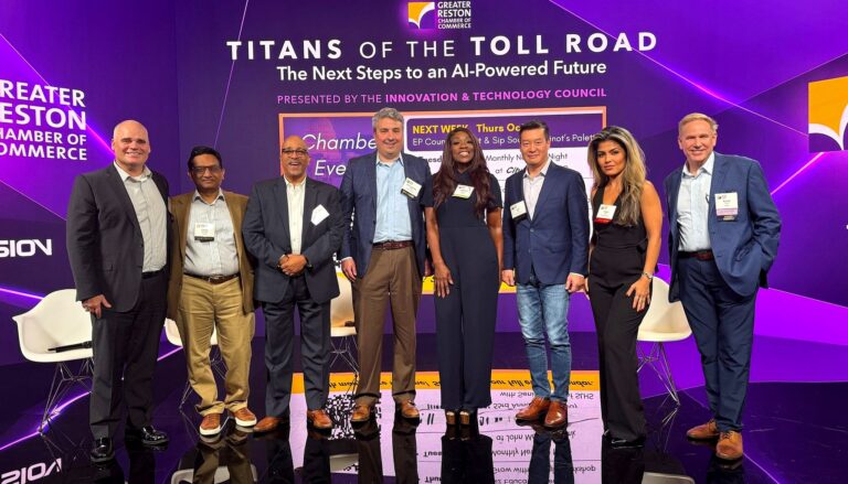 eight professional panelists standing on stage at a Greater Reston Chamber of Commerce event titled "Titans of the Toll…