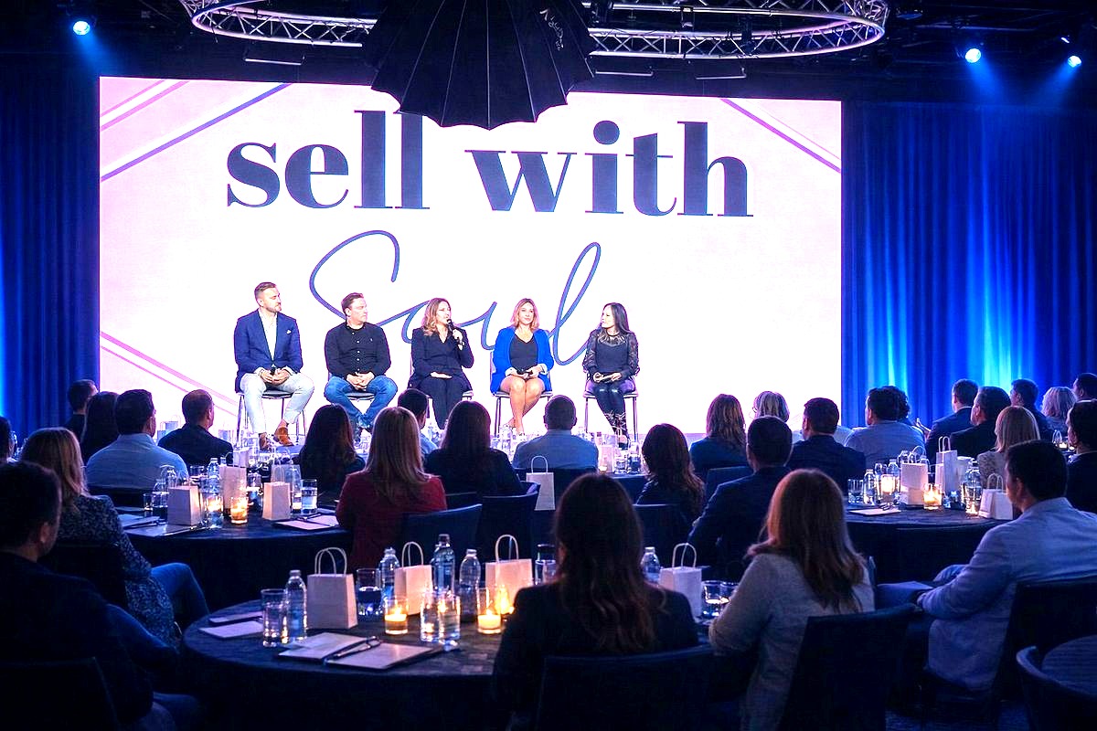 This image captures a professional panel discussion or conference event titled 