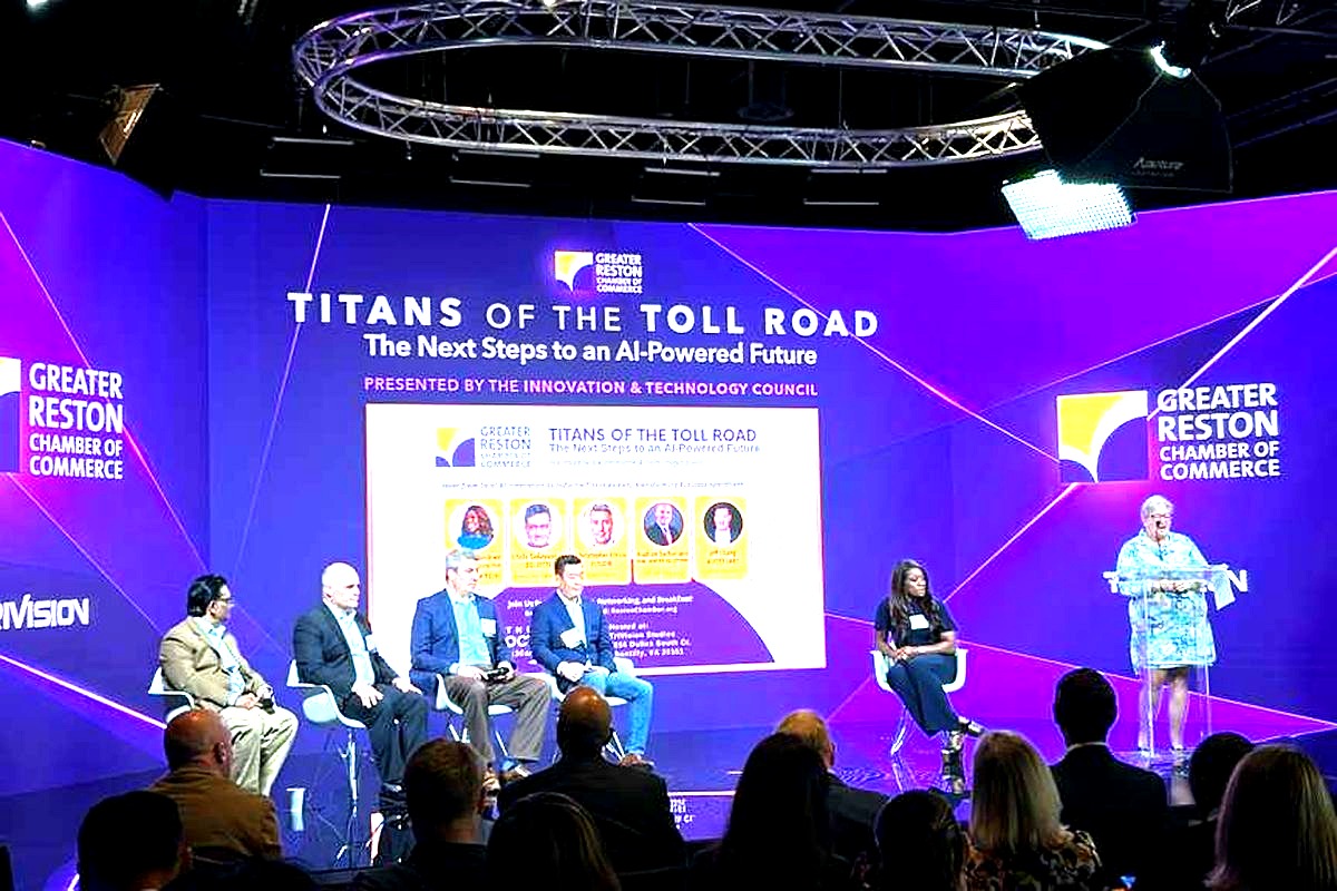 A professional conference panel discussion featuring 
