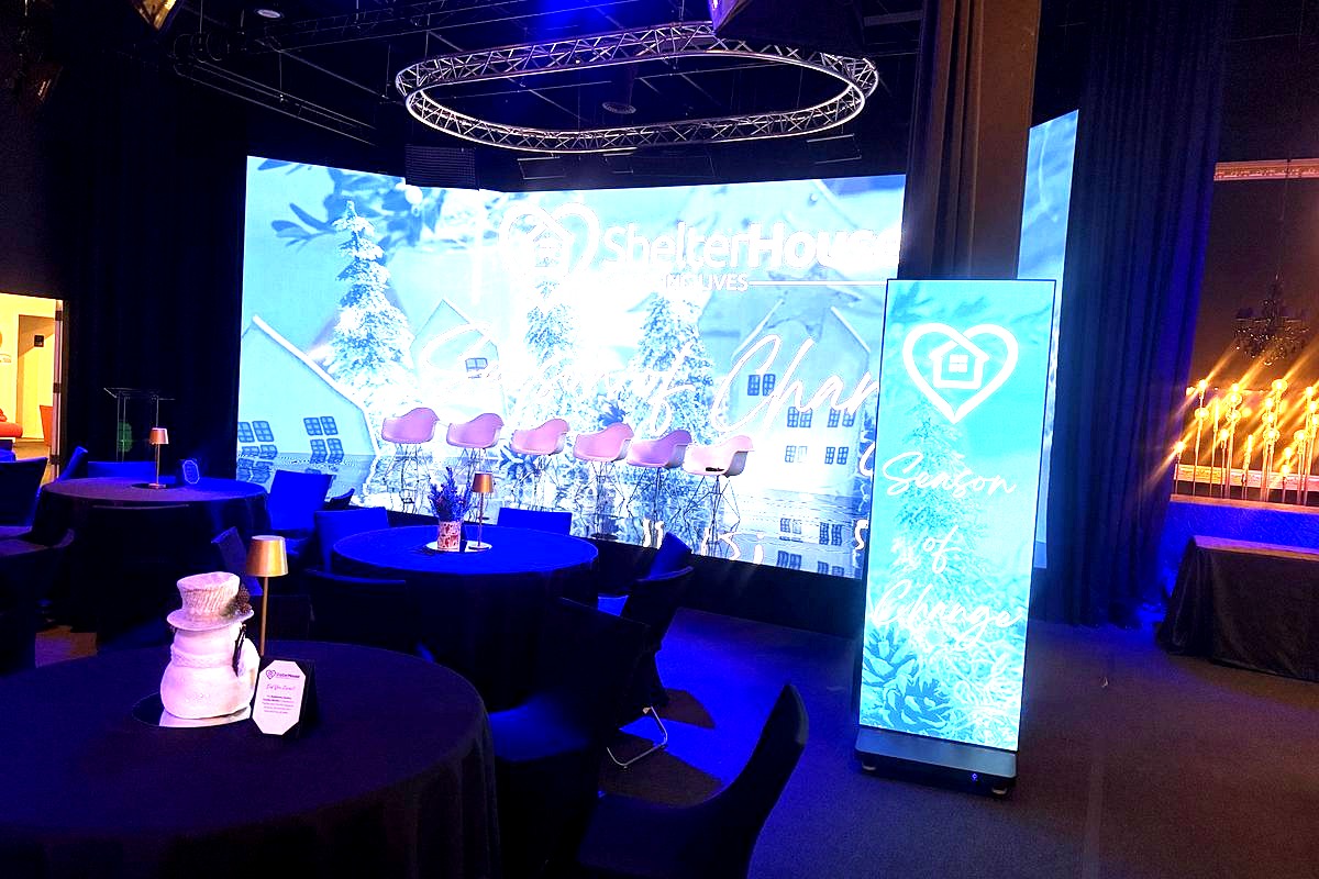 a professional event venue setup for ShelterHouse's 