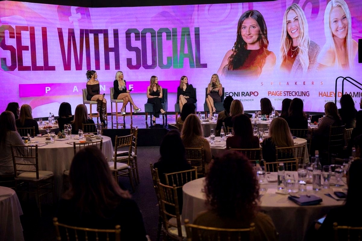 # Image Description

This image captures a professional panel discussion event titled 