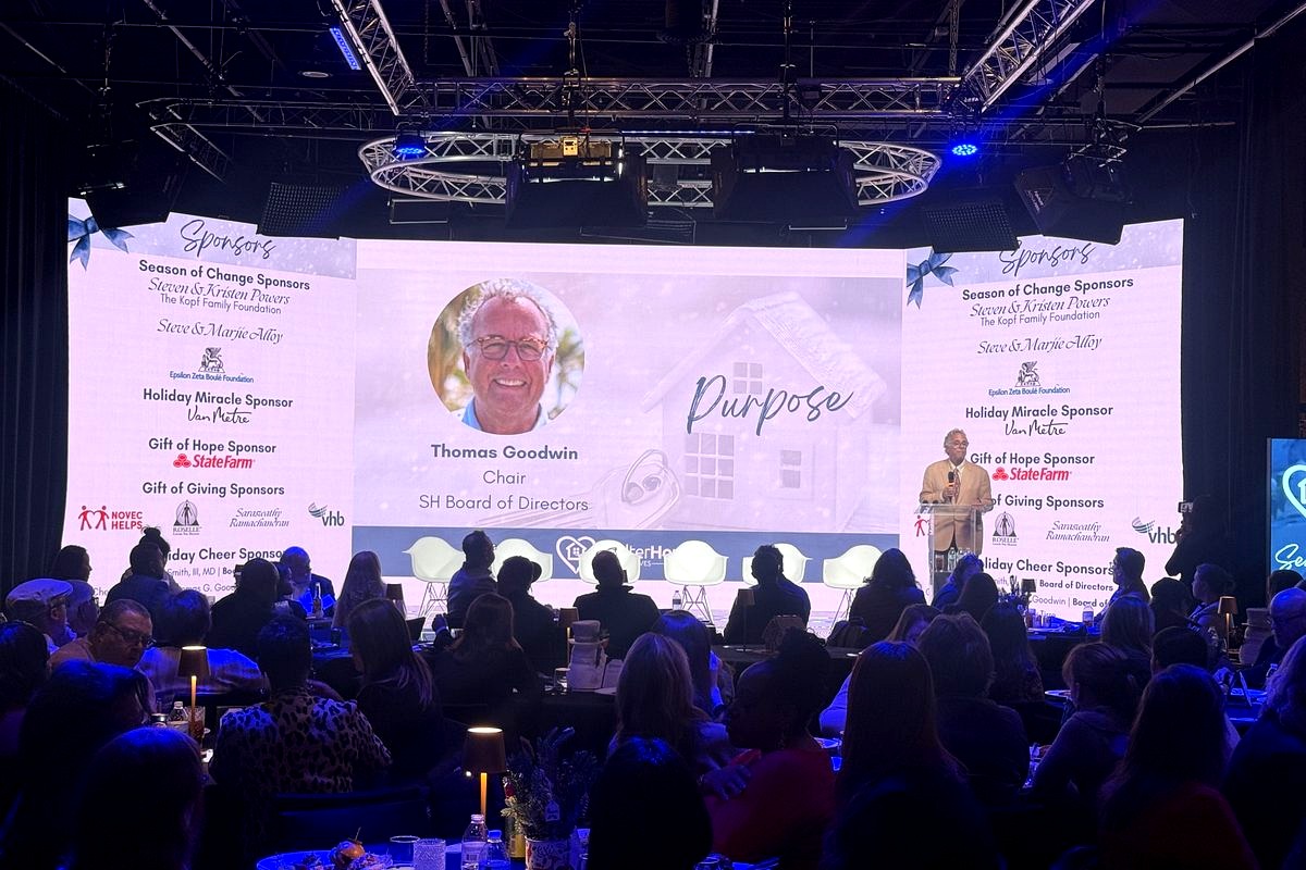 This image captures a formal charity gala or fundraising event featuring Thomas Goodwin, Chair of the SH Board of Directors…