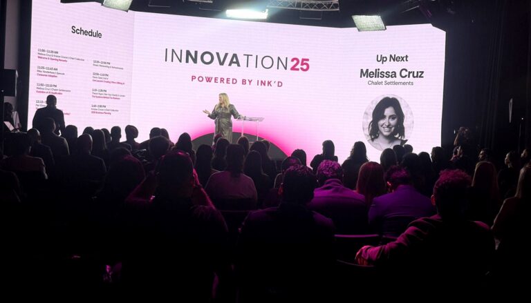 This image captures a speaker presenting at the "Innovation25" conference powered by Ink'd, with an audience silhouetted in…