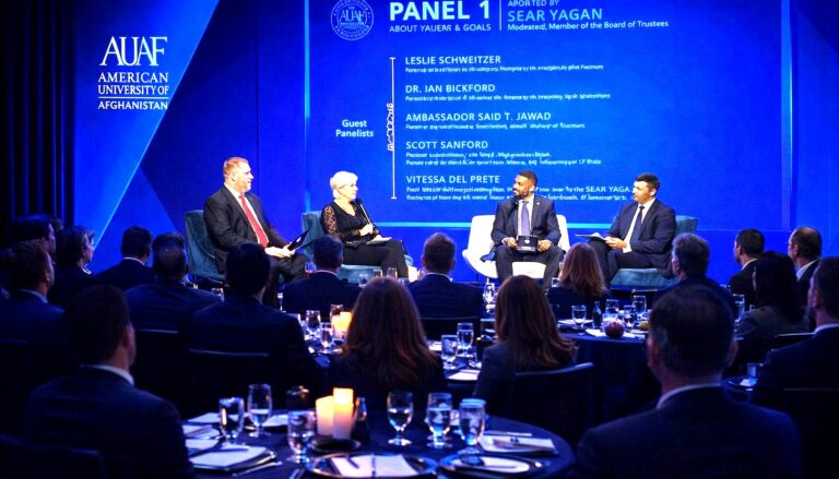 a formal panel discussion at the American University of Afghanistan (AUAF) event, with four guest panelists discussing the…