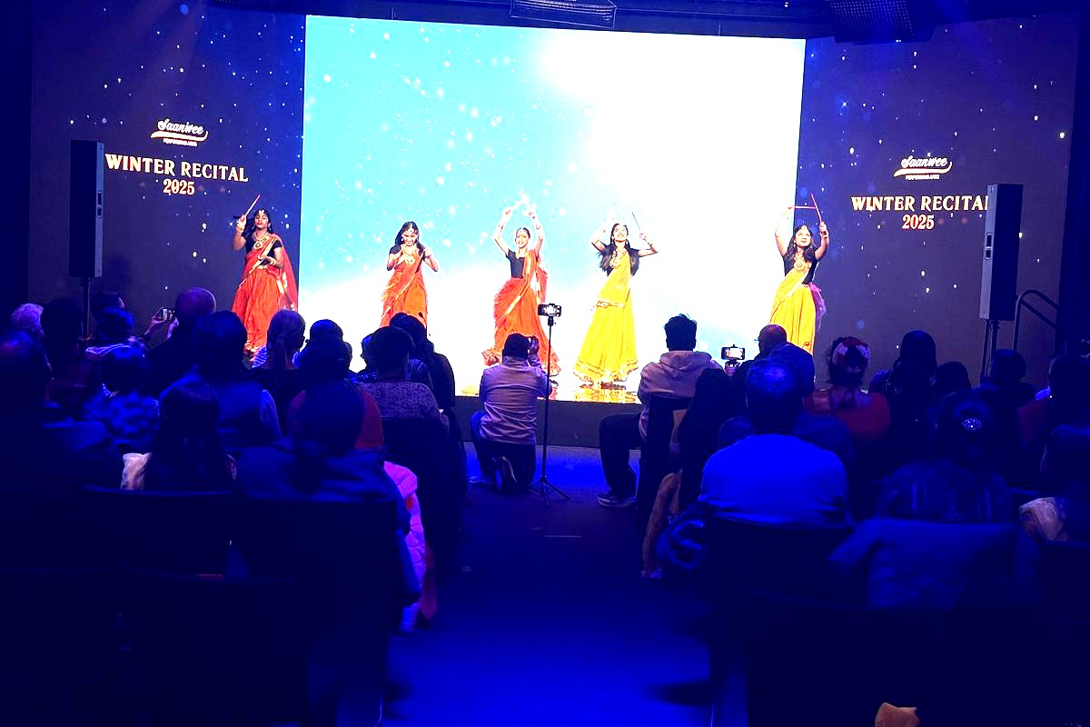 # Winter Recital 2025 Performance
This image captures a vibrant stage performance featuring five dancers in colorful…